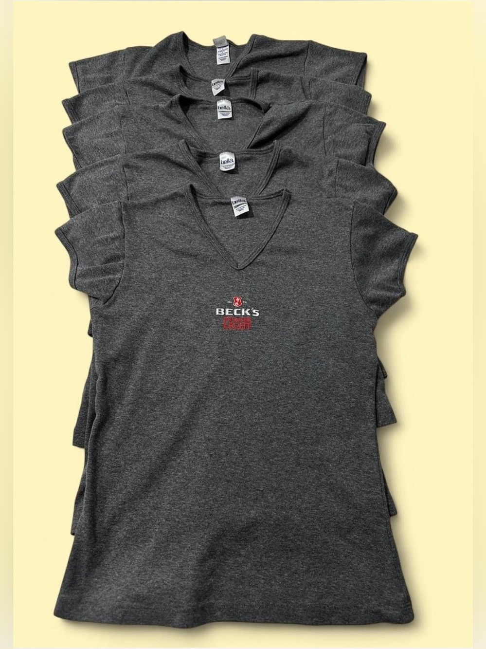 Bundle of 5 Beck's Charcoal V-Neck Logo Tee.